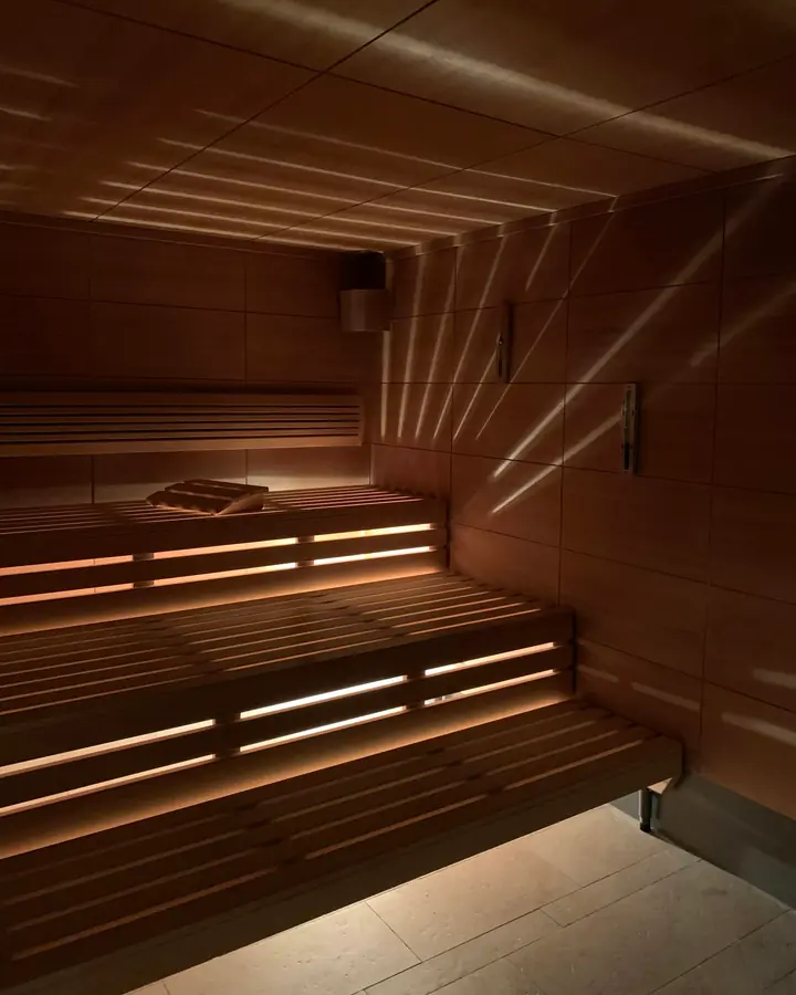 The warm benches of the sauna, the other half of a contrast session